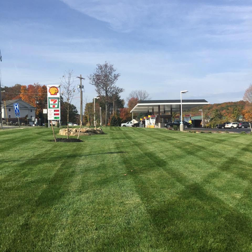 Commercial property lawn maintenance at a Sussex County retail site